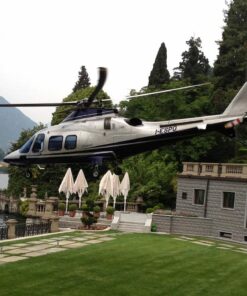 Exclusive helicopter tour: an aircraft flies over the waters of Lake Como.
