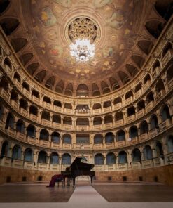 Grand auditorium of Bologna's Teatro Comunale, a key venue in the UNESCO City of Music tour, with a piano on stage