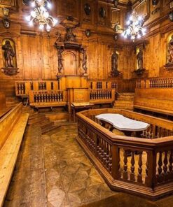 The historic wood-paneled Anatomical Theatre of the Archiginnasio in Bologna, with its central marble dissection table