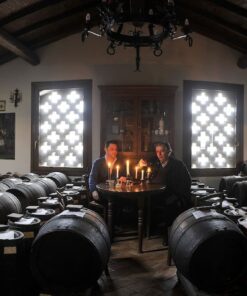Rows of wooden barrels for aging traditional balsamic vinegar in a Modena acetaia.